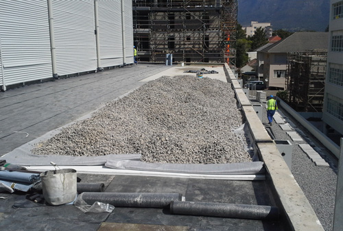 Roof Waterproofing, Insulation, Drainage Membrane and Stone Ballast in progress.